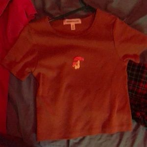 Brownish crop top shirt with mushrooms on it